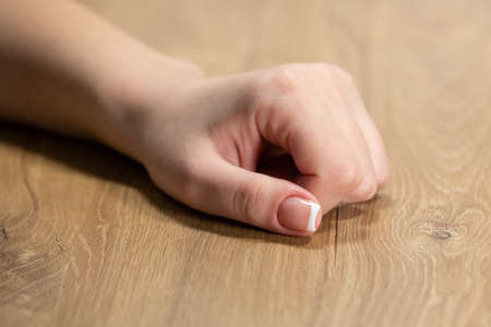 Hands with beautiful nails painted bright, manicure close upの写真素材