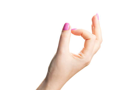 Beauty woman hands with pink fashion manicure. Isolated image close upの写真素材