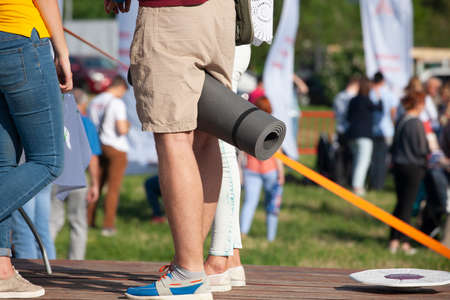Teens at concert at summer festival. Legs of teenager at summer music festival Close-up