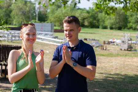 Beautiful loving couple flirting in the park on beautiful sunny day Portraitの写真素材