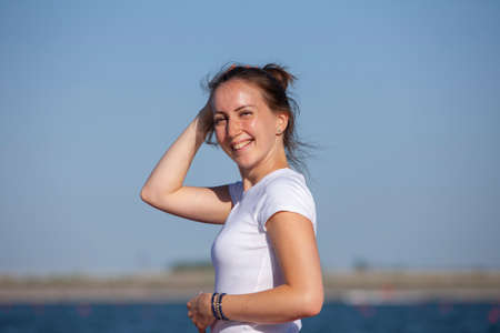 Pilates yoga workout exercise outdoor in the lake pier. Portrait