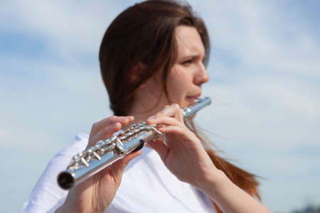 Musicians or beautiful women outdoor. Nature, meditation. Listen to your heart. A flute, unity with...