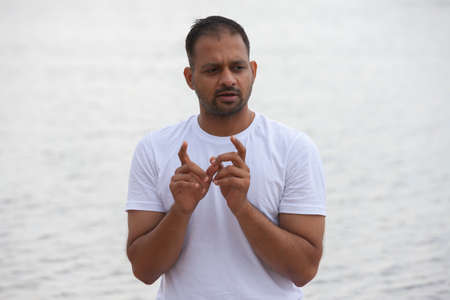 Man doing yoga exercise in the morning.. Portrait