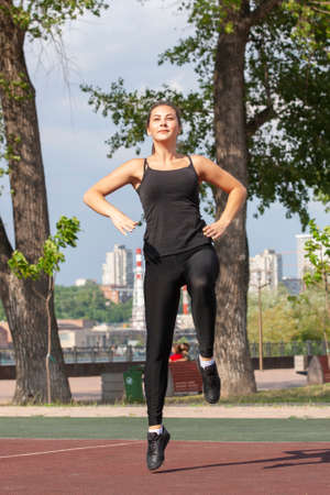 Fit woman exercising outdoors, healthy lifestyle and exercise concept. Pullups