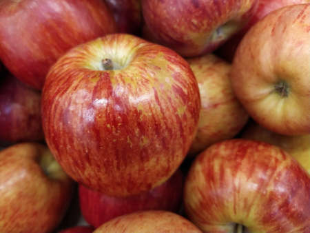 Group of red apples with their leaves. Close-upの写真素材