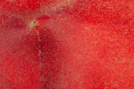 the skin of the peach as a background. close-upの写真素材