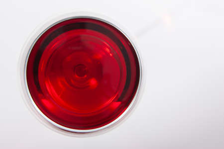 Glass of red wine with shadow.Top view . Close-up