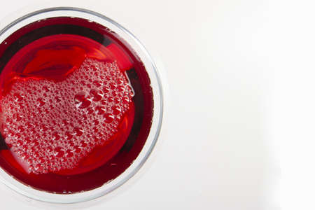 Glass of red wine with shadow.Top view . Abstract red wine bubbles. Close-upの写真素材