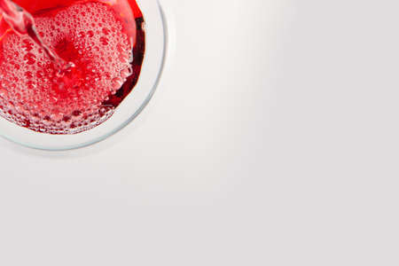 Glass of red wine with shadow.Top view . Abstract red wine bubbles. Close-upの写真素材