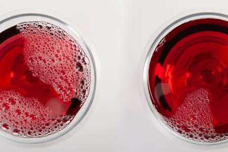 Glass of red wine with shadow.Top view . Abstract red wine bubbles. Close-upの写真素材