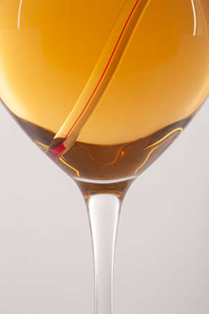 Measuring White Wine Temperature with a Wine Thermometer. Close-upの写真素材