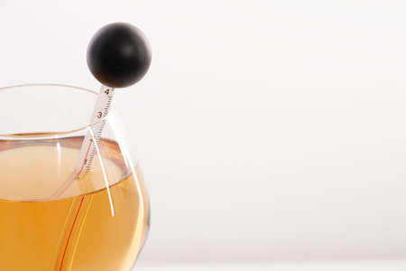 Measuring White Wine Temperature with a Wine Thermometer. Close-upの写真素材