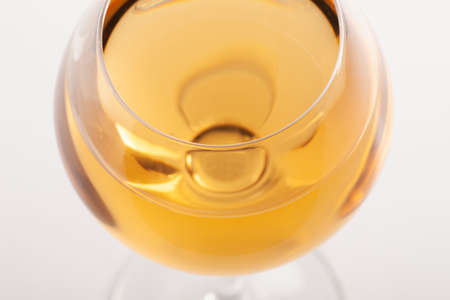Glass of white wine with shadow. Top view . Abstract red wine bubbles. Close-upの写真素材