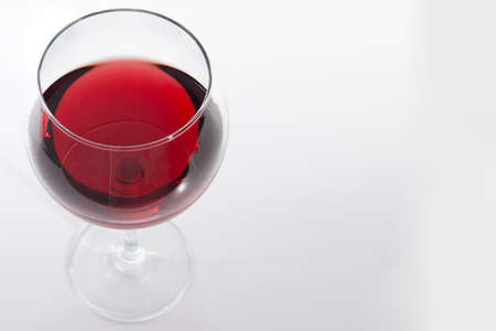 Glass of red wine with shadow.Top view . Close-upの写真素材