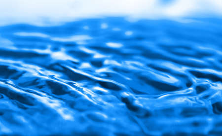 Wave pattern on blue water.の写真素材