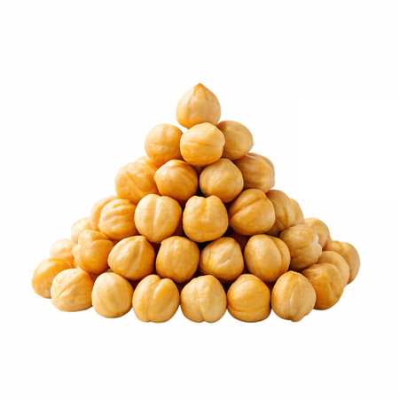 Creative arrangement of hazelnuts stacked in a pyramid shape, isolated on transparent backgroundの素材