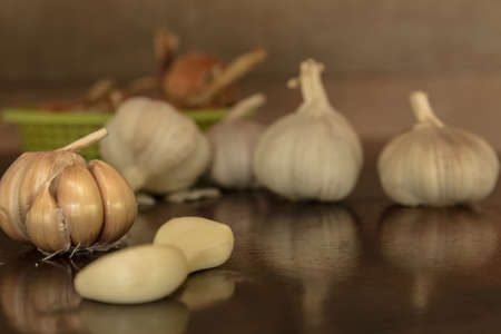 garlics on wooden table.の写真素材