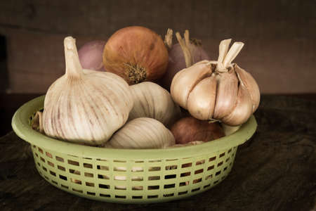 Garlics in a basketの写真素材