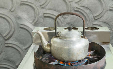 boiled water,vintage kettle on gas stove.の写真素材