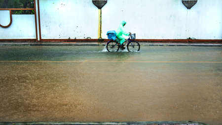 flood on the road and footpath in Thamai Chanthaburi Thailandの写真素材