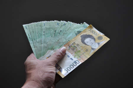 Hand full of moneyの写真素材