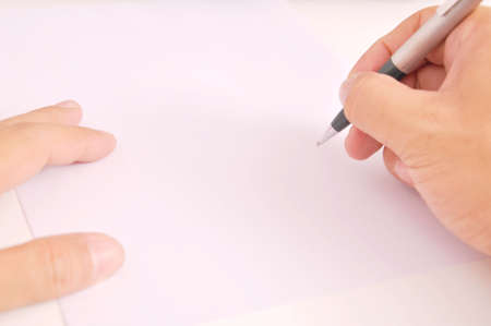 A picture of holding pen with white paperの写真素材