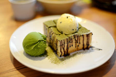 Cake and ice-cream on a plateの写真素材