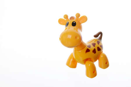 Cute toy giraffe on a white background.の写真素材
