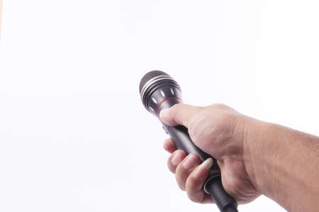 Microphone with black handle in human handの写真素材