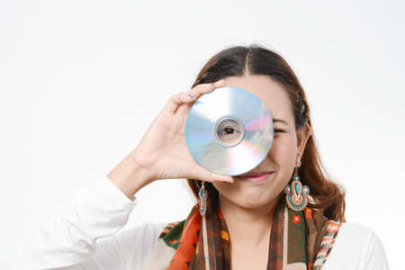 asia women holding Data Disc on white backgroundの写真素材