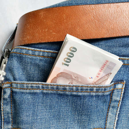 Thailand Money in blue Jean の写真素材