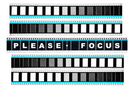 Piece of 35 mm motion film with the word 'please focus' on itの写真素材