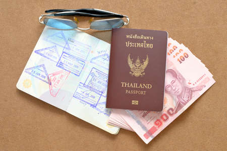 Thailand passport and Thai money 
