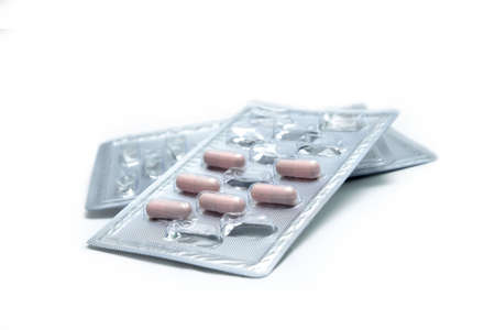 Packets of pills on white background