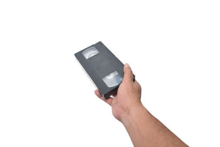 VHS cassette in hand isolated on white backgroundの写真素材