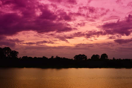 Sunset on river in the summer , Evening sky , Landscape , Backgroundsの写真素材
