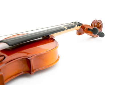 aged handmade violin on white background