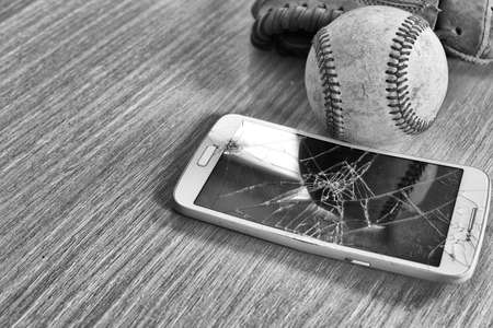 Cracked smart phone baseballの写真素材