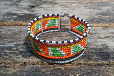 ethnic beaded jewelry isolated on wooden backgroundの写真素材