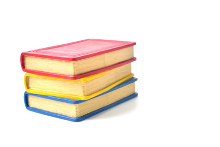 Stack of books - books stacked isolated on white backgroundの写真素材