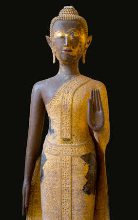 Old Buddha statue isolated on black backgroundの写真素材