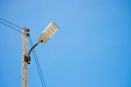 electric streetlight  pole with blue skyの写真素材