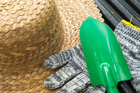 Image of gardening hat with shovel and gloves