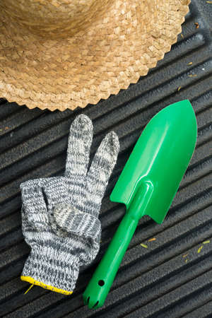 Image of gardening hat with shovel and glovesの写真素材