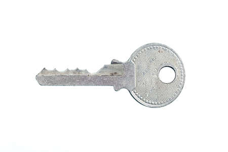 Small key isolated on white backgroundの写真素材