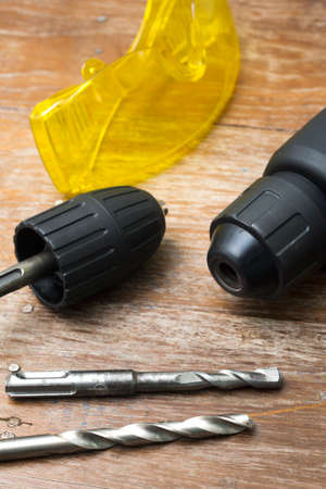 Cordless Power Drill on wooden tableの写真素材