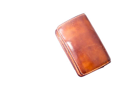 photo of a brown leather wallet on a white background.