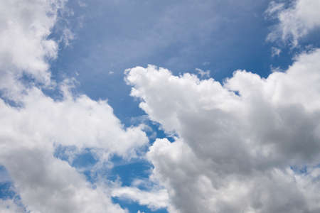 White clouds, blue sky, on a bright dayの写真素材