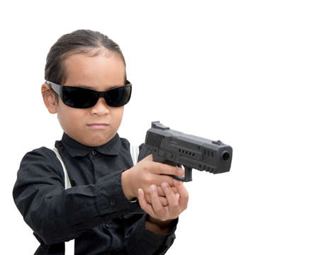 young asia boy with gun isolate on white background.の写真素材