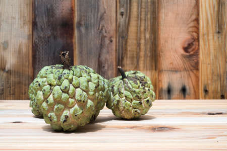 Custard apple on wood background , sweetsopの写真素材